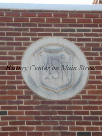 MSNS Logos above the doors of the Campus Junior HIgh School.